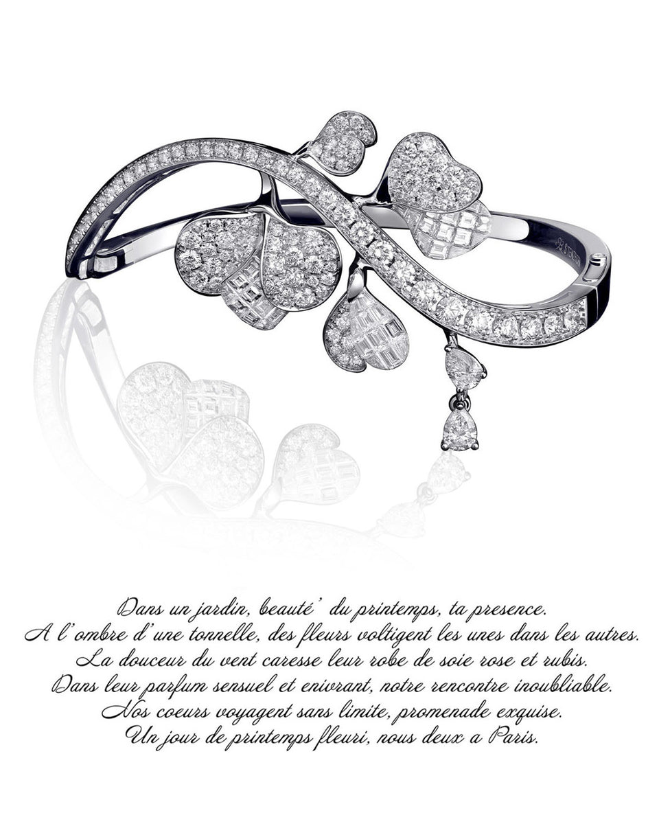 white gold bangle with diamonds an a french poem